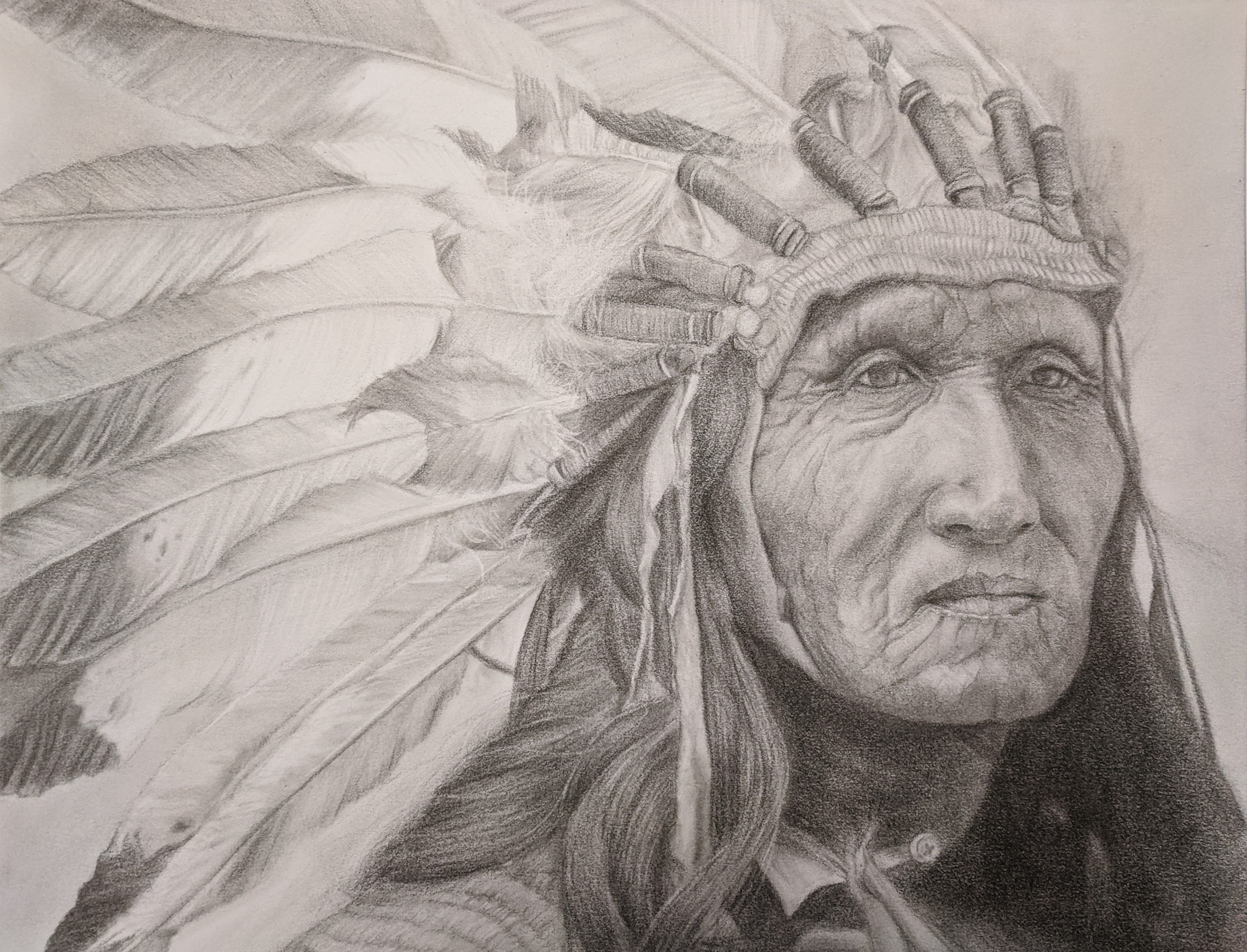 Three-quarter view portrait of Chief He Dog as an old man in full eagle feather headdress.