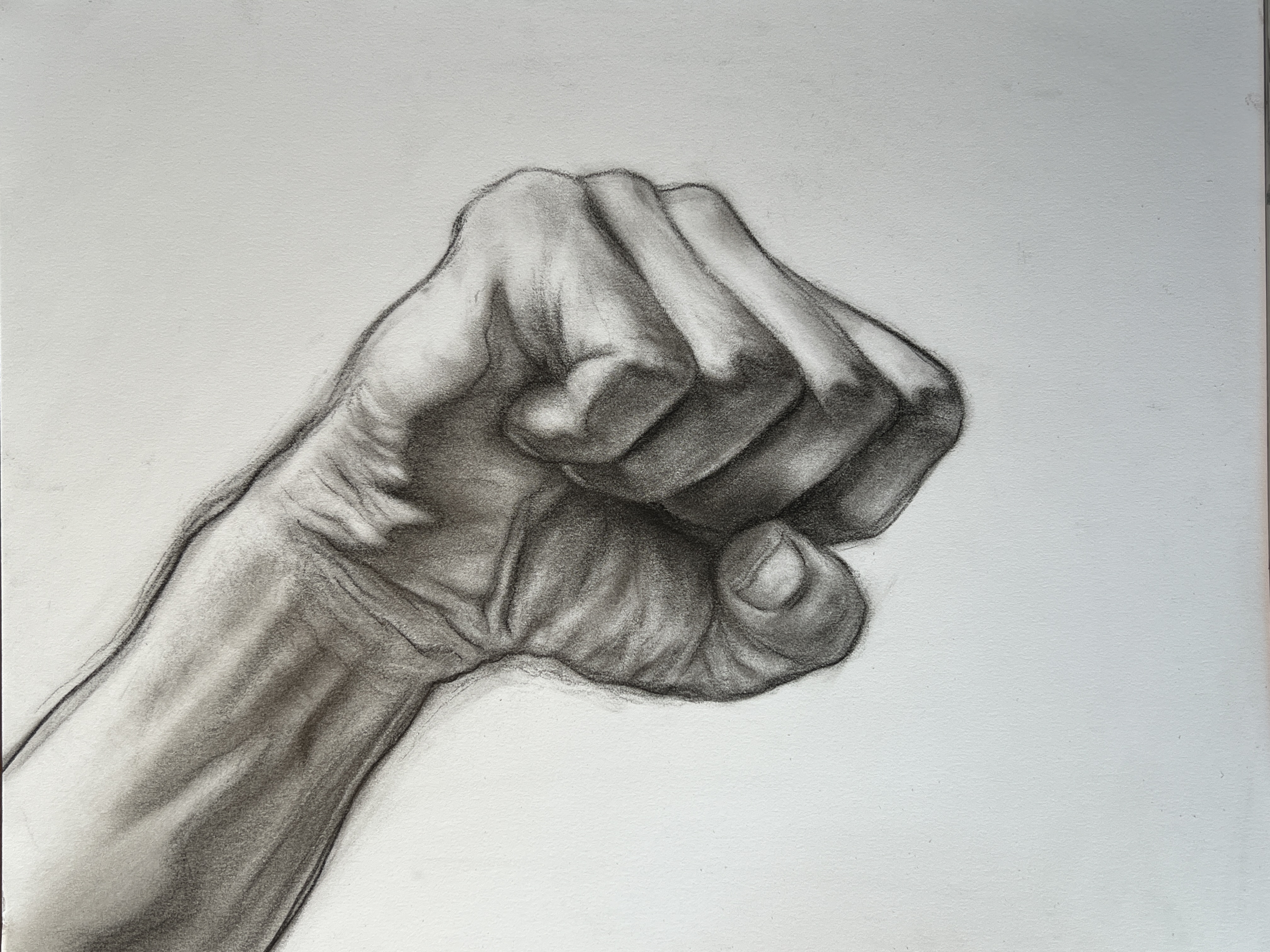 Charcoal drawing of a fist